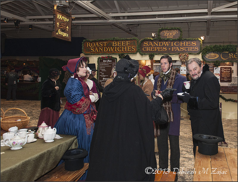 Ebenezer Scrooge and Bob Cratchit taking a spot o'tea