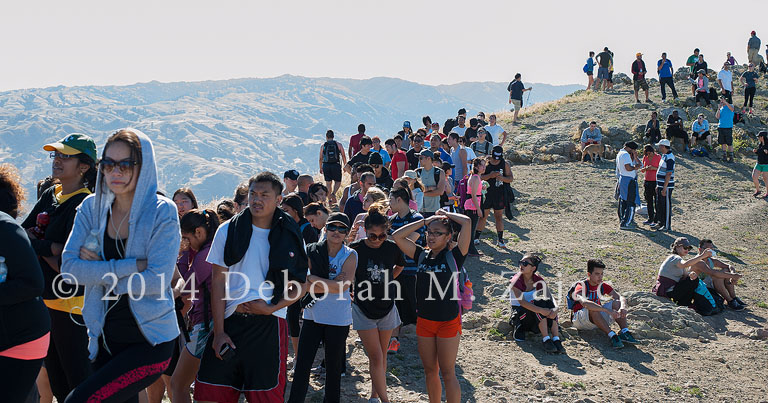 Line of hikers to Mission Peak Pole waiting to take their photo