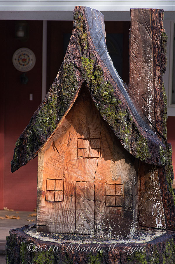 Carved house from tree stump
